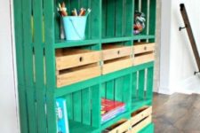 03 a bright emerald shelving unit built of crates and a wooden tabletop for a kids’ space