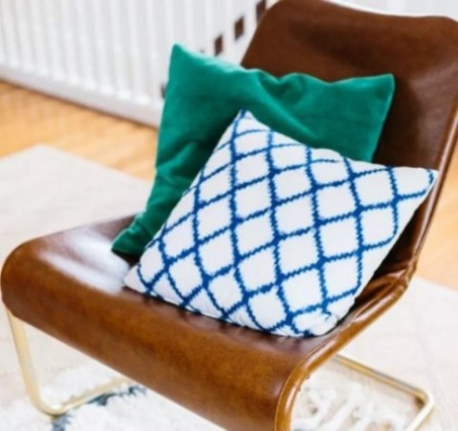 an IKEA Loksta chair hack with brown leather looks very stylish and will accent any mid century modern room