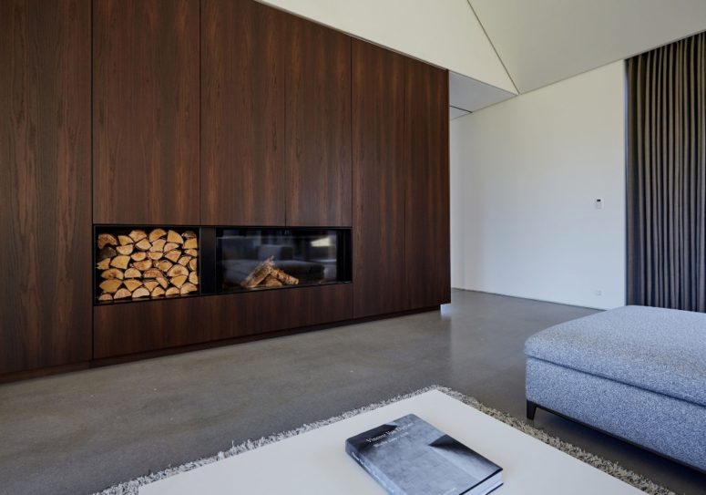 The appliances are built-in, and so is the fireplace, the floors are concrete