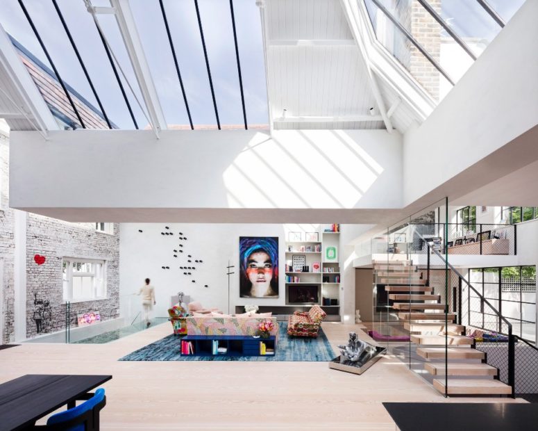 The owners' art collection was displayed in different spaces and a white home was a cool frame