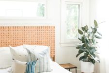 04 a muted orange woven leather headboard is a stylish accent for this boho bedroom that adds a warm feel to it