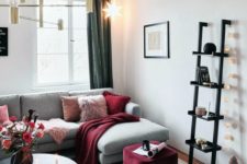 05 a glam chandelier, a garland of lights and a bold star-shaped hanging lamp for illuminating the space
