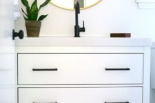 05 an Ikea Hemnes 2-drawer sink cabinet hacked with elegant black handles and a white countertop