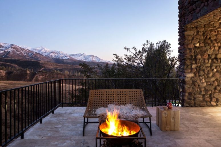 a terrace with a simple yet awesome fire bowl There are ample terraces with gorgeous mountain views, contemporary furniture and a fire bowl