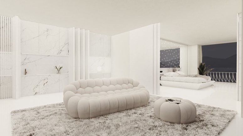 There's a lounge here, a sleek white marble kitchen and the spaces can be separated with a space divider for privacy