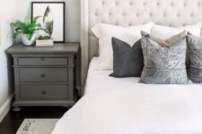 06 a creamy upholstered bed and a statement tall wingback headboard is a chic yet neutral enough idea for a farmhouse bedroom