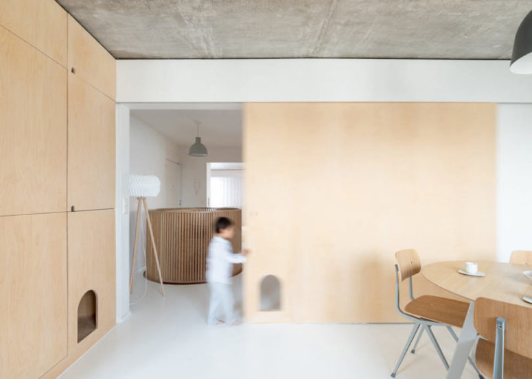 The color scheme is neutral, done with concrete, light colored wood and touches of grey here and there The color scheme is neutral, done with concrete, light-colored wood and touches of grey here and there