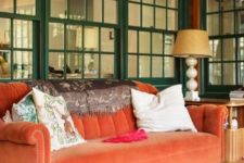 08 an orange velvet sofa brings traditional fall chic to this screened porch and makes it feel like fall