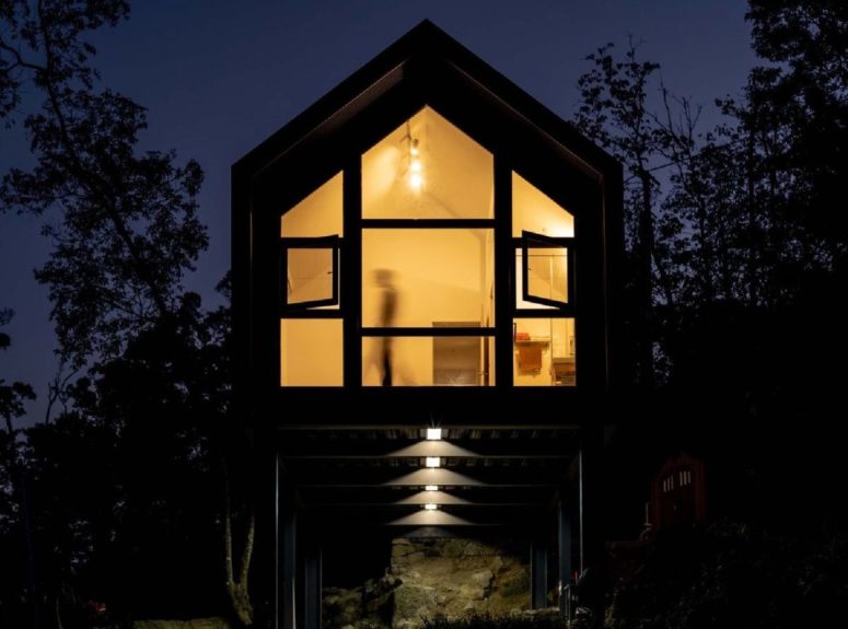 pitched roof design always works The double pitched roof gives the house a cute look while also being practical in this climate