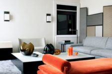 10 a minimalist interior with a colorful statement – an orange velvet daybed