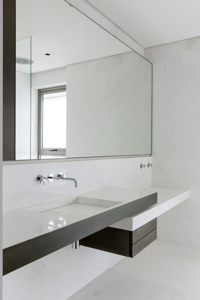 Large mirrors reflect the views and give the bathrooms a very bright and airy feel