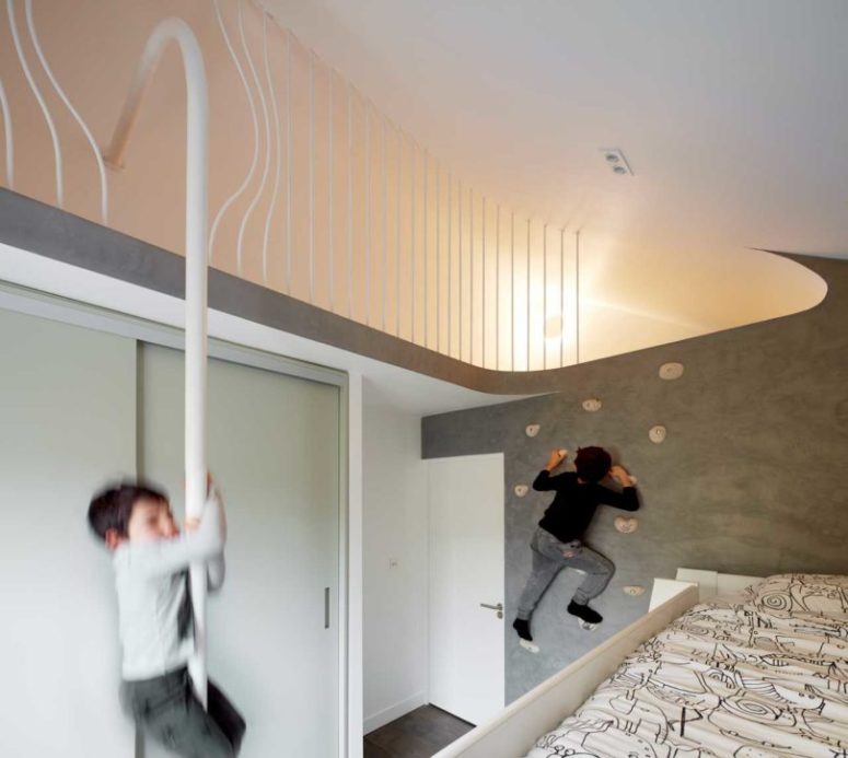 One kids' room features a climbing wall and other activity items for fun