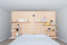 13 The master bedroom is done with a pegboard headboard for functionality and lots of shelves plus a bed