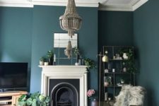 14 a dark beaded chandelier accented with a ceiling medallion is a gorgeos contrasting idea for this moody room