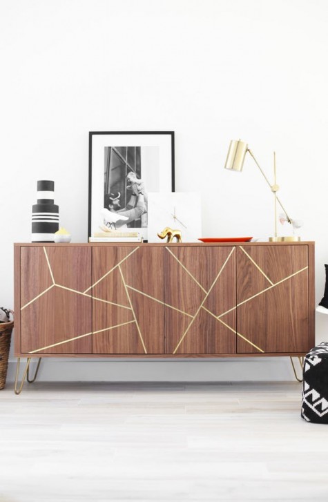 a Stockholm sideboard with gold hairpin legs and a geometric design made with gold foil tape