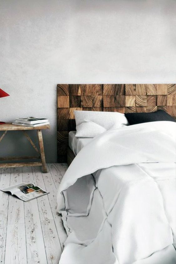 a wooden headboard made of slats stained dark is a very textural and very chic idea with a rustic feel