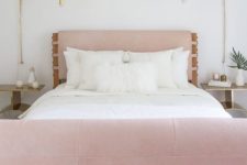 16 a pink leather upholstered headboard and foot of the bed make up a unique look