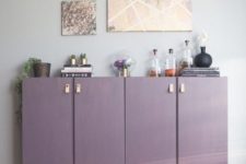 16 plain Ivar cabinets turned into a stylish home bar in purple, with copper legs and leather pulls
