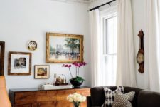 17 a gorgeous black chandelier styled as sconces contrasts the space and makes it stand out