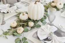 17 spruce up the tablescape with neutral pumpkins of various sizes and some fresh greenery