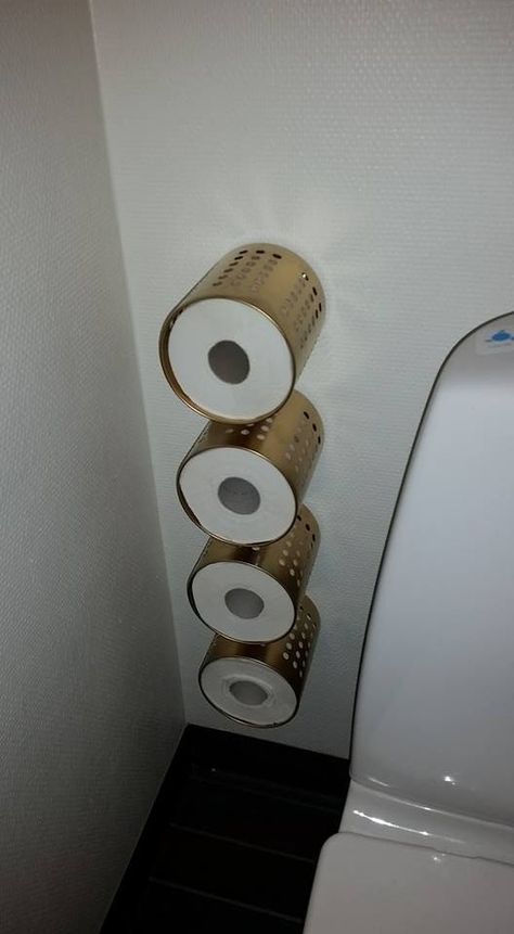 Ordning by IKEA used as toilet paper holders attached to the wall to save some space