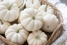 19 a basket with white pumpkins is a chic rustic fall decor idea for any space