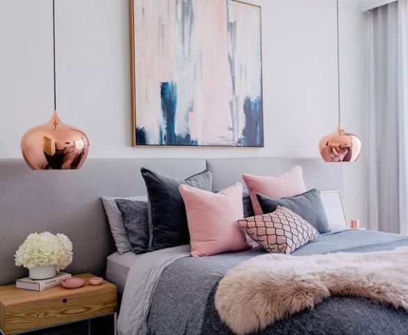 a feminine bedroom with touches of pink and cute copper pendant lamps for a chic look
