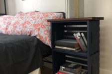 20 a modern farmhouse nightstand of black crates, a stained tabletop and metal legs is a chic idea