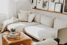 21 a large wall sconce with a lampshade adds coziness to the living room