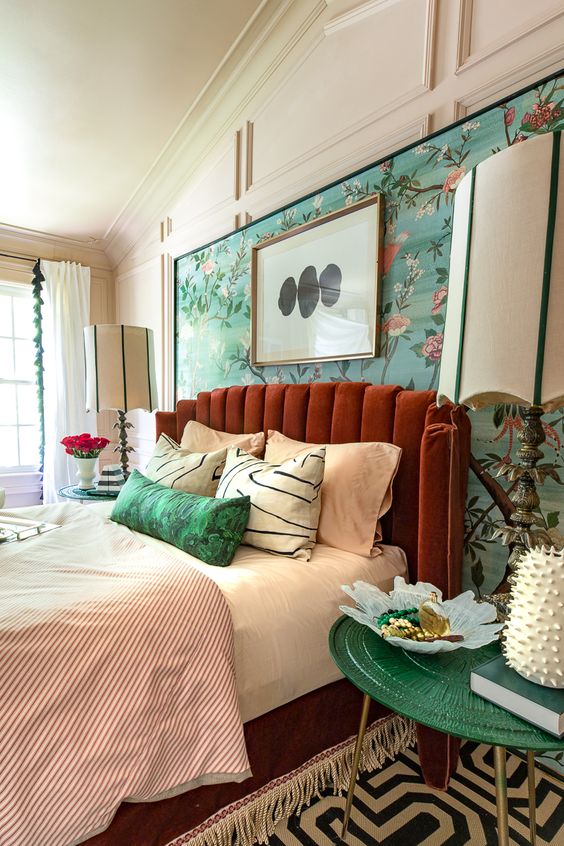 a rust colored padded headboard continues the bright color scheme and completes the space perfectly