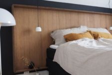 24 a sleek wooden headboard with a frame matches this Scandinavian bedroom and looks pretty and chic