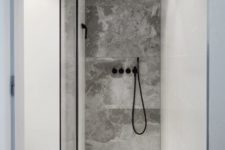 24 built-in LEDs and a light in the ceiling are enough to light up such a small shower space