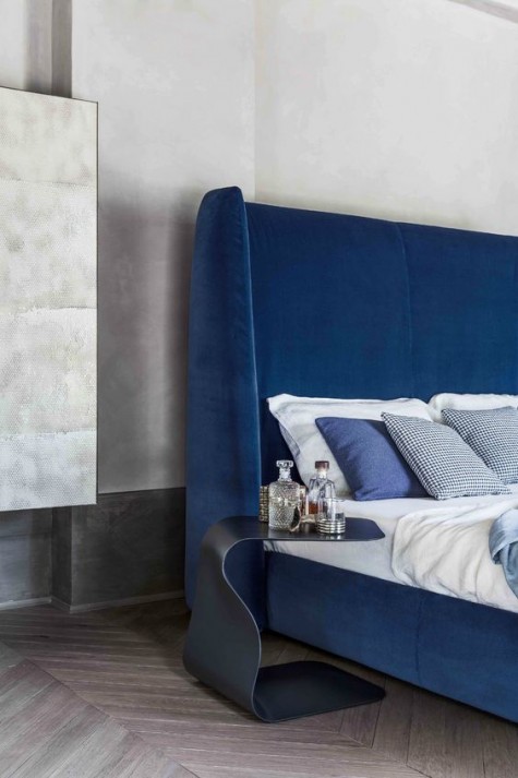 an ultra modern electric blue wingback headboard will make a super chic statement in your bedroom and even set the tone there