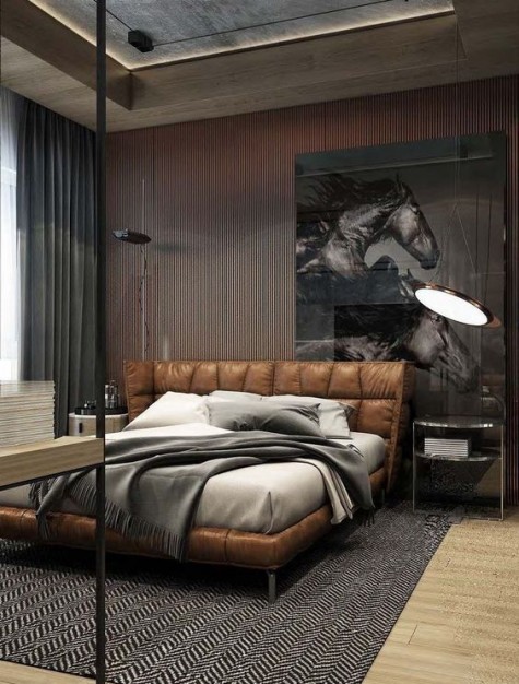 an upholstered brown leather bed features a padded leather wingback headboard that makes the bedroom cozier