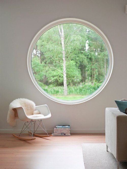 a large round window that brigns in much light and lets the owners enjoy the views a lot