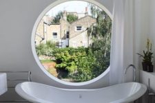 a vintage inspired bathroom design with a pothole window