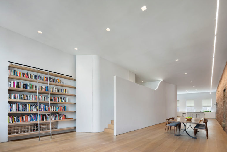 This contemporary New York loft was opened and decorated, and a sleeping space was built in creatively