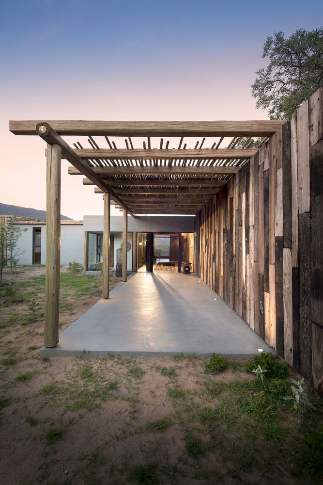 Vast terrraces and patios here and there make the interior spaces tightly connected to outdoors and the use of reclaimed wood makes them relaxed