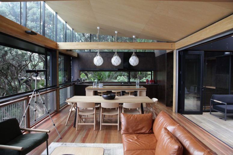 home with an open layout works when you're surrounded by such views The main layout is an open space with a kitchen, dining room and living room and in natural shades plus light-colored wood