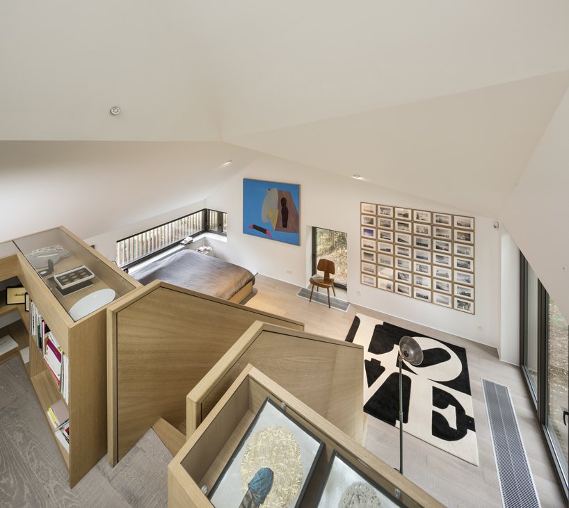 The layout features two levels with living, sleeping, working and office zones and each of them is accented visually