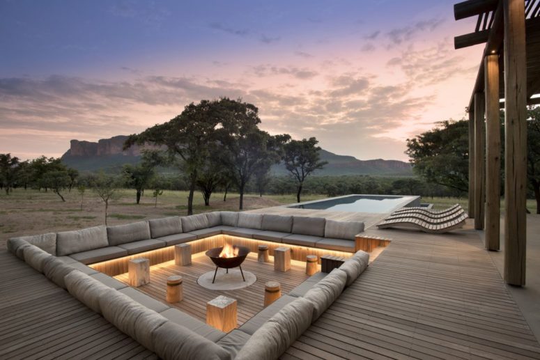 The outdoor sitting area is built into the wooden deck and has accent LED lighting, a perfect place to get relaxed