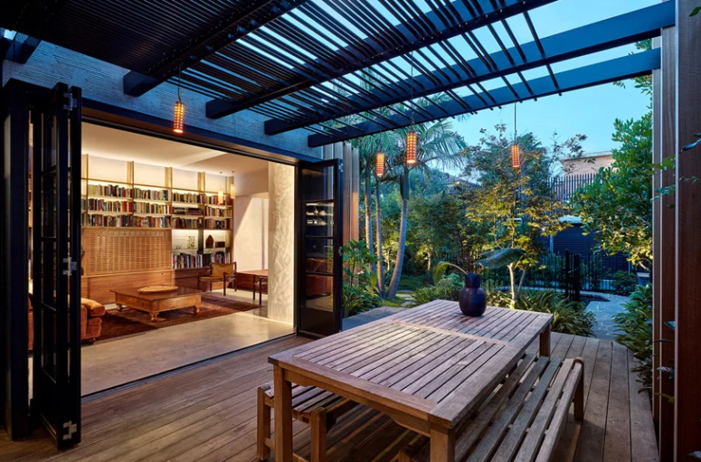 The terrace is done with much wood and a simple dining set, the folding doors open indoor spaces to it The terrace is done with much wood and a simple dining set, the folding doors open indoor spaces to it