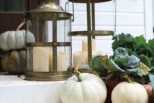 16 pumpkins, green leaves, candle lanterns are all you need for decorating your porch for the fall
