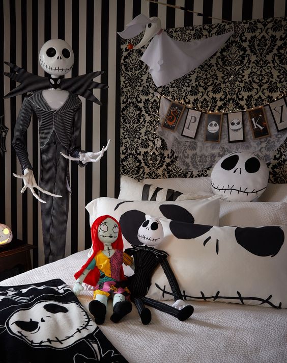 a black and white Halloween bedroom in Jack Skellington style, with dolls, a bunting, bedding and a Ghost dog