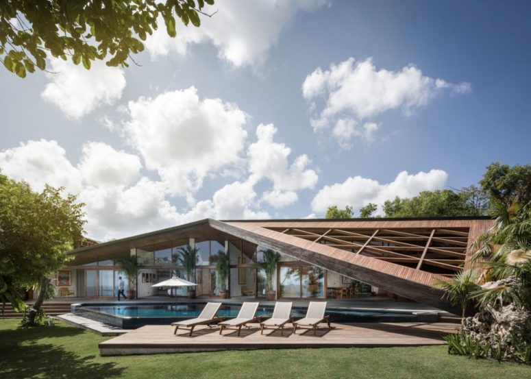 Carbon House With A Sculptural Roof Over The Patio