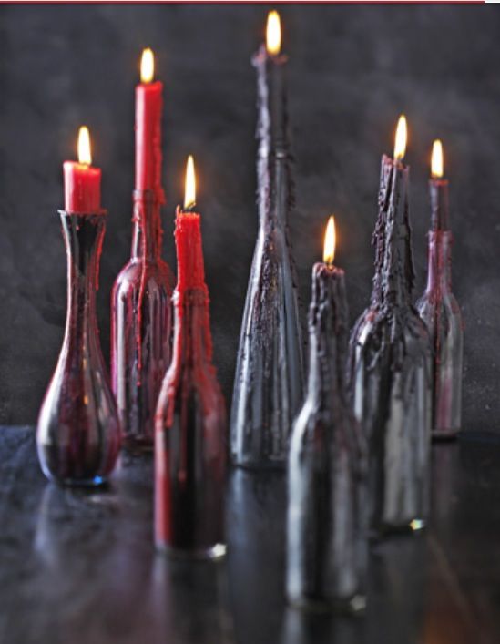 black bottles with red and deep purple wax from candles on them look scary and bloody, so you won't have to decorate the holders too much