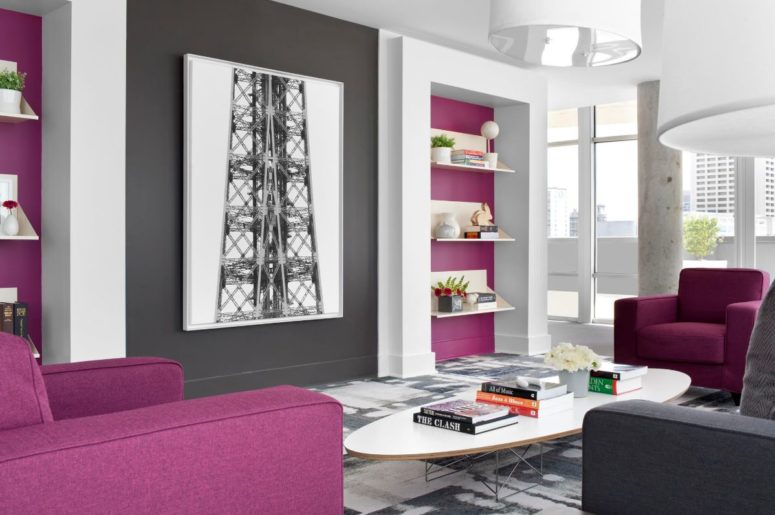 a monochromatic living room in grey and white was refreshed with fuchsia wall accents and furniture pieces