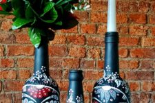 03 bottles painted with Mexican Day of the Dead sugar skulls can be used as candleholders or vases for blooms