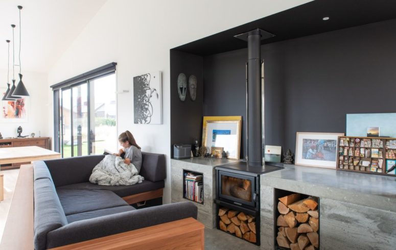 One of the pavilions of the house contains social areas and a wood burning stove plus some stone shelves on each side of it One of the pavilions of the house contains social areas and a wood-burning stove plus some stone shelves on each side of it