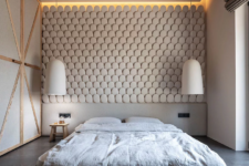 05 The bedroom is done with a scale statement wall, pendant lamps and a platform bed